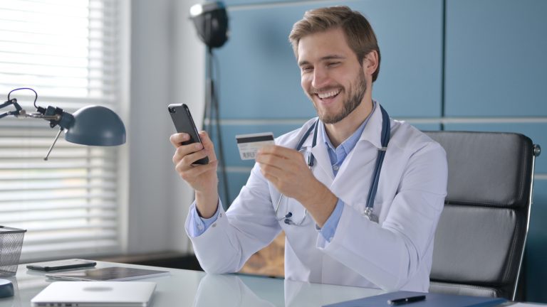 health professional buying insurance online from smartphone