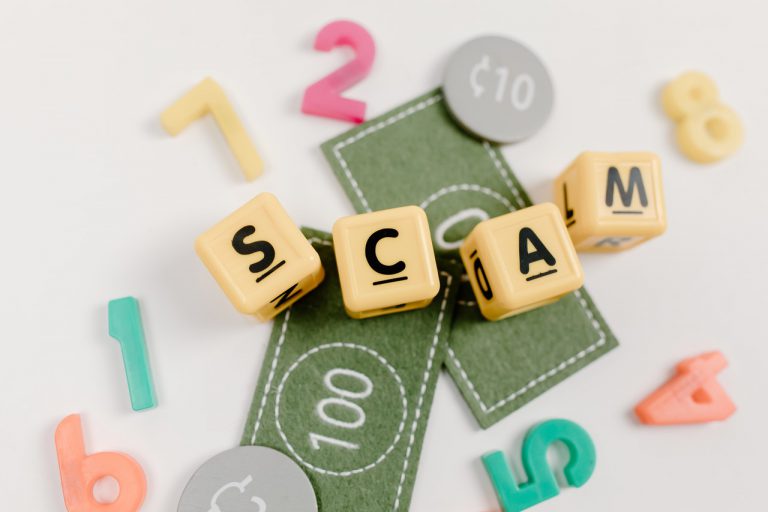 blocks that spell out scam
