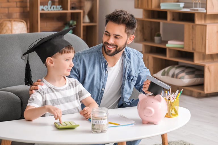 Father following Financial Wellness advice to learn how to save for his son's college education
