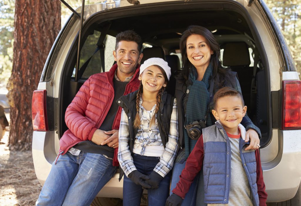 Hispanic family on vacation with Safeguard plan protection