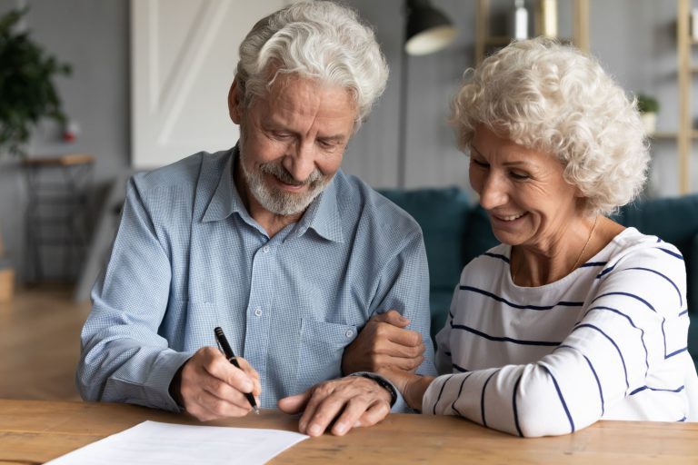 Couple over the age of 65 signing up for Medicare Insurance